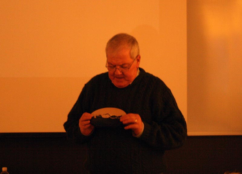 Michael Miller discusses one of his paintings of lunar craters.