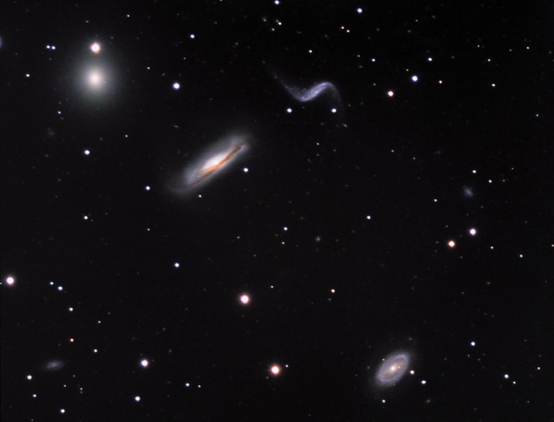 Four galaxies in Leo with distinctly different shapes.  From left to right, they are: NGC 3193, an elliptical galaxy; NGC 3190, a spiral galaxy viewed nearly edge-on; NGC 3187, with an angular "S" shape, and 3185, with an outer ring and a central bar.  Several smaller galaxies are also visible.