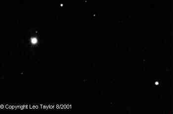 Photos taken by Leo Taylor
Uranus is the big dot in the above images, taken on August 15 & 25, 2001.
Notice bump on planet, the full size images show two moons each. 
The planet moved more than two of these 12 minute wide FOVs in 10 days
Leo Taylor with his Meade 2080 8 in f/10 SCT with SBIG CCD, 15 second exposure 


