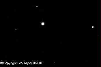Photos taken by Leo Taylor
Uranus is the big dot in the above images, taken on August 15 & 25, 2001.
Notice bump on planet, the full size images show two moons each. 
The planet moved more than two of these 12 minute wide FOVs in 10 days
Leo Taylor with his Meade 2080 8 in f/10 SCT with SBIG CCD, 15 second exposure 
