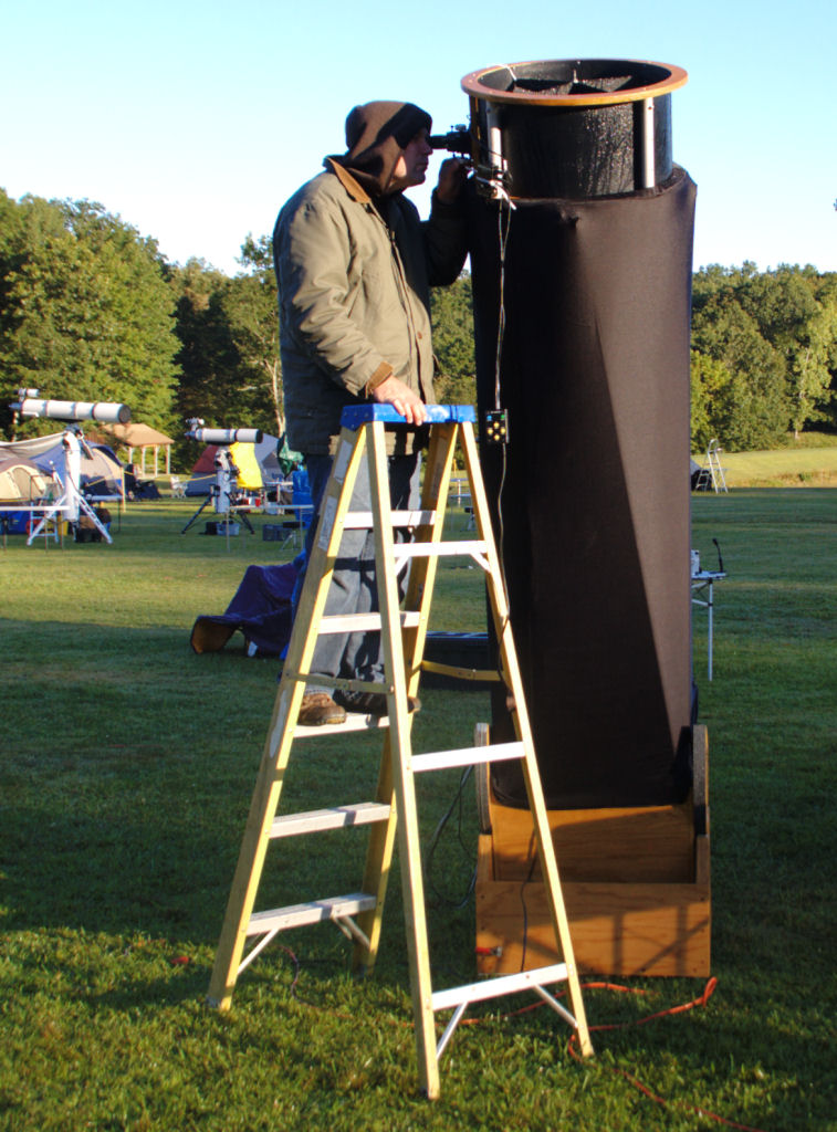 Photo by  Leo Taylor
Shane LaPierre looking at Mars in his 20 inch Dobsonian... with the 
Sun shining. We could see dark areas on the surface and the Polar Cap 
which Shane could not see a few hours earlier when it was dark.
