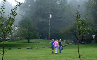 Photo by Ray Kaville
A few people take advantage of a break in the clouds to get out and take a walk around the scout camp.

