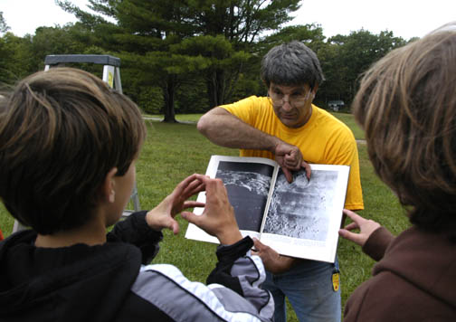 Photo by Alan Chaniewski
Al Washburn showing craters on the moon, before his students make their own.
