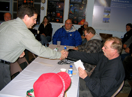 Photo by Alan Chaniewski
Winter Solstice party 12/13/08 - ASNH President Greg Barker presents Jim Podpolucha a gift in appreciation for being the club's Tresurer for many years.
