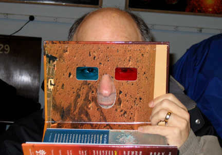 Photo by Alan Chaniewski
Winter Solstice party 12/13/08 - Ruben getting a nose up on a new 3-d book.
