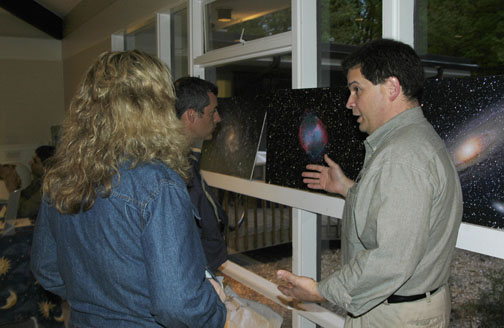 Photo by Alan Chaniewski
ASNH President Greg Barker shows off Rubin Kier's astrophotography.
