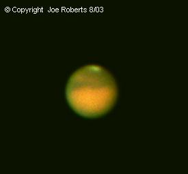 Mars Aug 15,2003 by Joe Roberts
Polar cap visible, the "land mass" not identified
Vixen 102 ED refractor, Daiken 2.4x Barlow, 10mm Celestron Plossl 
Olympus C3030Z, 4 Images of 1/20 second
