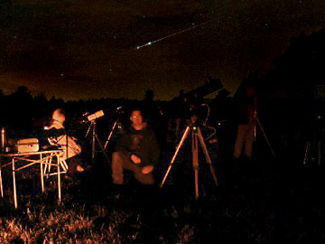 Walt Kupson's Telescope Gallery
A one a million shot! A meteor burst into 2 fragments as my son C.J. and I pose for a picture.
