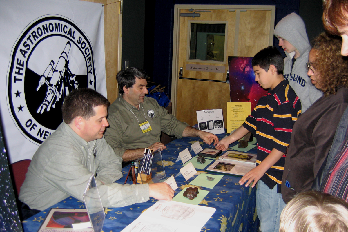 Photo by Alan Chaniewski
Peabody Museum - 3/31/07 - Greg Barker and Al Washburn talk with a visitors at the ASNH table at the Alien Earth's exhibit. 
