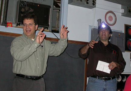 Photo by Ray Kaville
Winter Solstice party 12/13/08 - ASNH President Greg Barker and Quiz master Al Washburn talk about the start of the quiz. 
