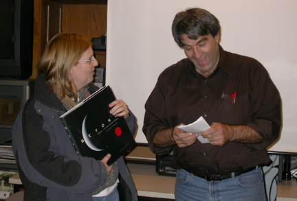 Photo by Ray Kaville
Winter Solstice party 12/13/08 - Quizmasteer Al Washburn reads off all the answers to the quiz next to the winner.
