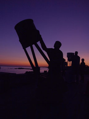 Photo by Alan Chaniewski
At the 14th annual Madison Moonwalk held at he Madison Surf Club, Greg Barker sets up his "cannon" for a busy night of viewing.
