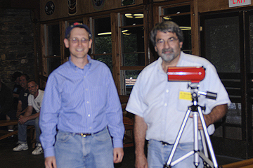 Photo by Alan Chaniewski
Al Washburn presents a new telescope to the lucky raffle winner.
