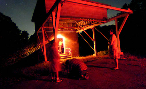 Photo by Alan Chaniewski
Al Washburn kneels down to help a youg astronomer with his 
telescope look at Jupiter.
